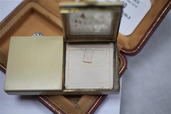 A 1920s French Cartier silver gilt, diamond and cream enamel double lidded compact, 85mm.